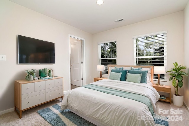 bedroom with light carpet