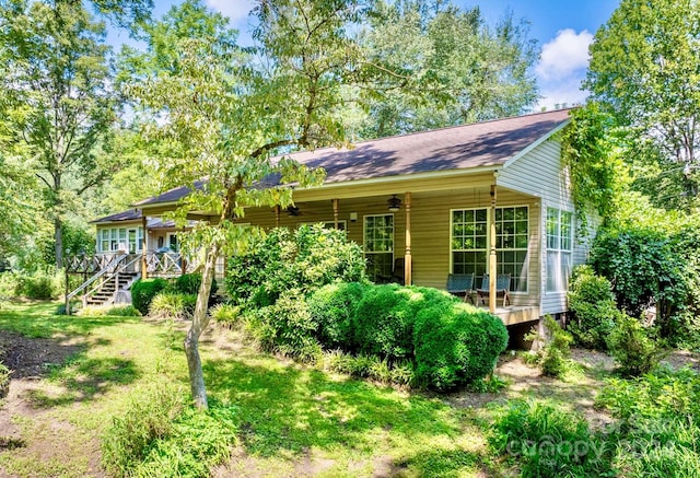 rear view of house with a lawn