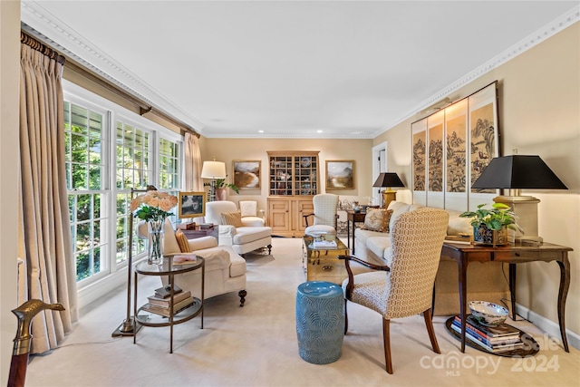 living room featuring ornamental molding, light carpet, and a wealth of natural light