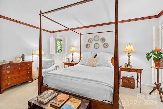 carpeted bedroom featuring crown molding