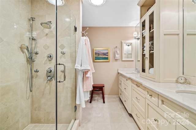 bathroom featuring vanity, walk in shower, and tile patterned flooring