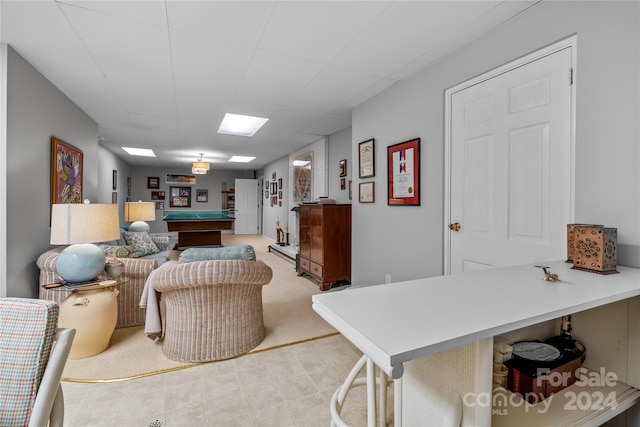 carpeted living room with pool table