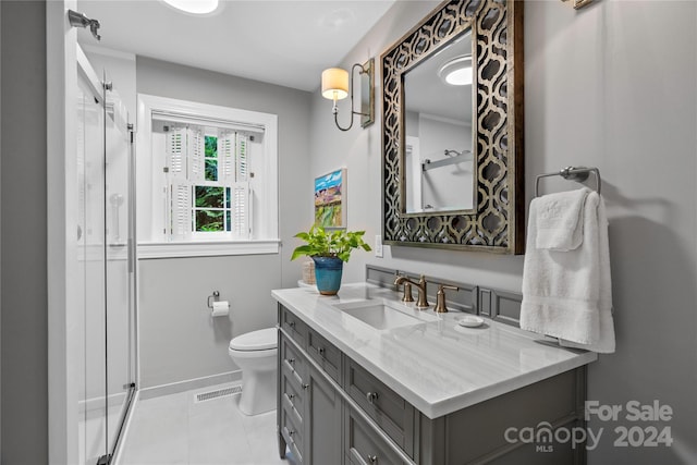 bathroom with tile patterned flooring, toilet, and vanity