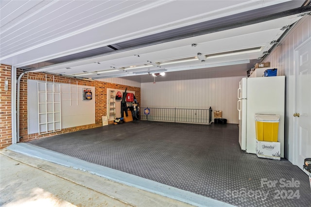 garage with white refrigerator