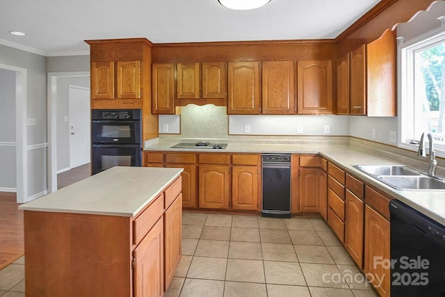 kitchen with light tile patterned floors, light countertops, ornamental molding, a sink, and black appliances