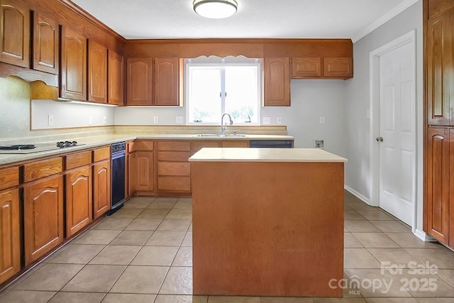 kitchen with a center island, black electric stovetop, light tile patterned floors, light countertops, and a sink