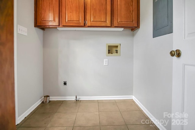 laundry room with washer hookup, cabinet space, tile patterned flooring, electric panel, and baseboards