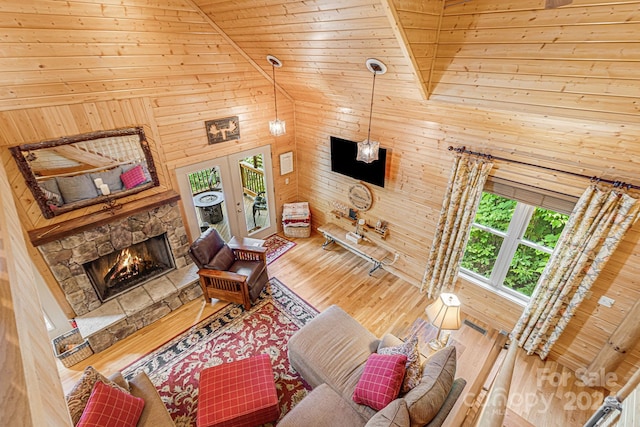 living room featuring hardwood / wood-style floors, high vaulted ceiling, and wooden ceiling