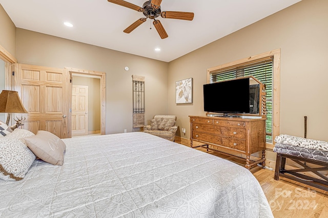 bedroom featuring light wood-type flooring and ceiling fan