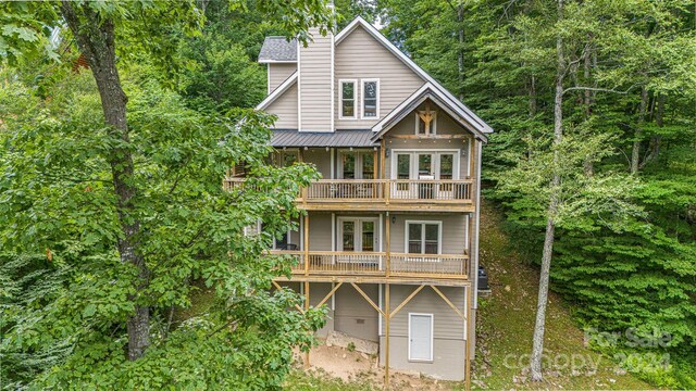 back of house with a balcony