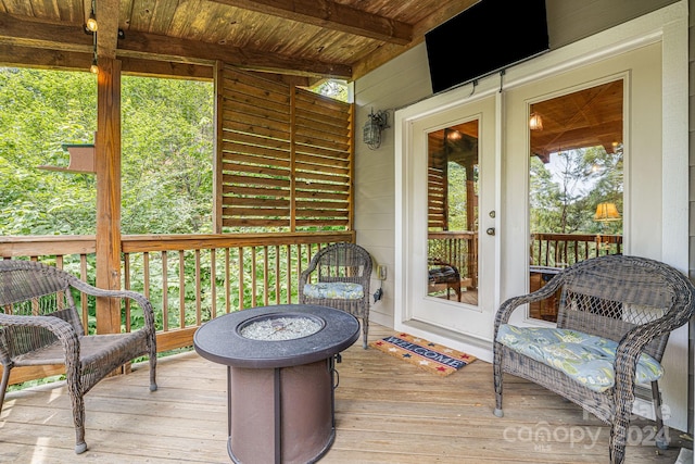 sunroom with wooden ceiling and beam ceiling