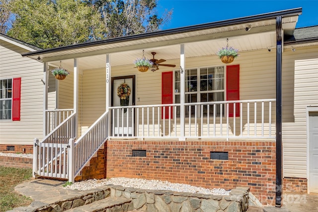 view of exterior entry with a porch