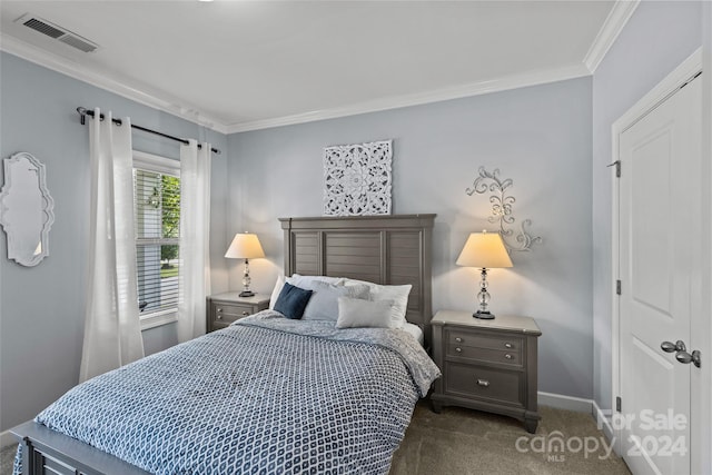 carpeted bedroom with crown molding