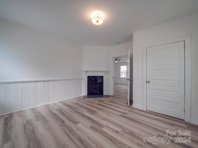 unfurnished living room with light wood-type flooring