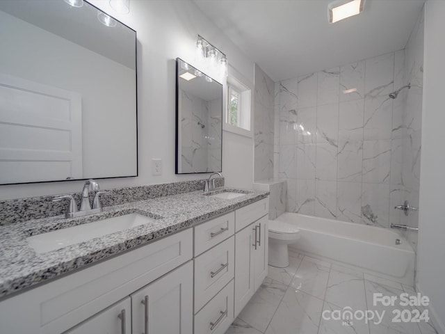 bathroom featuring marble finish floor, bathing tub / shower combination, a sink, and toilet