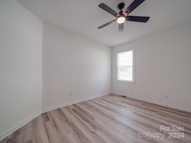 spare room featuring ceiling fan and light wood-type flooring