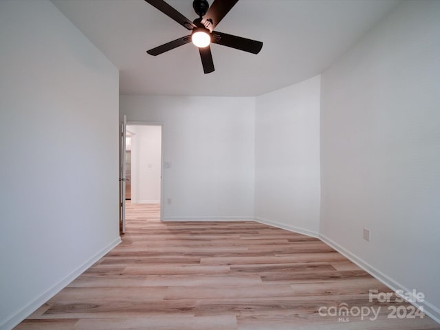 spare room featuring ceiling fan and light hardwood / wood-style floors