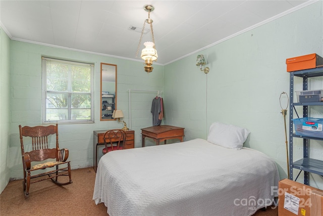 carpeted bedroom with ornamental molding