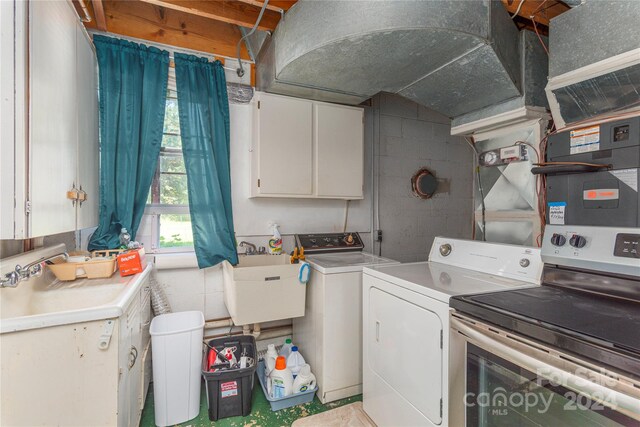 laundry room with sink and separate washer and dryer