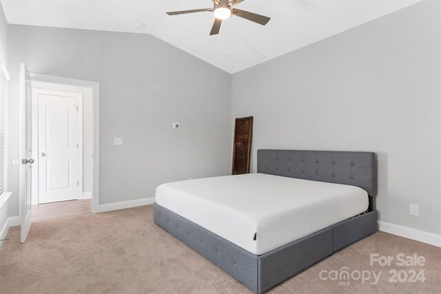 carpeted bedroom with lofted ceiling and ceiling fan