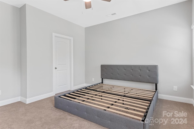 bedroom with light carpet and ceiling fan