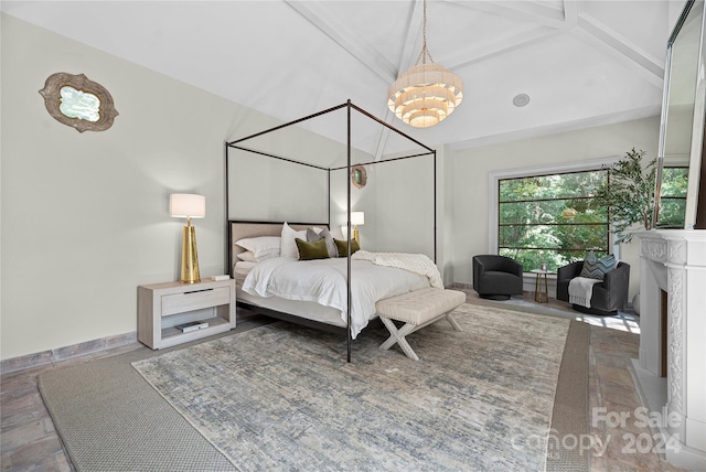 bedroom featuring an inviting chandelier, hardwood / wood-style floors, and vaulted ceiling with beams