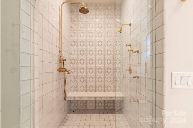 bathroom with a tile shower