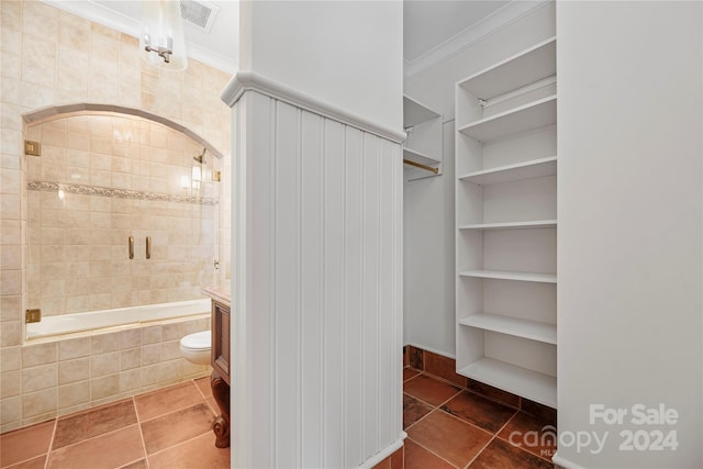 walk in closet with dark tile patterned floors