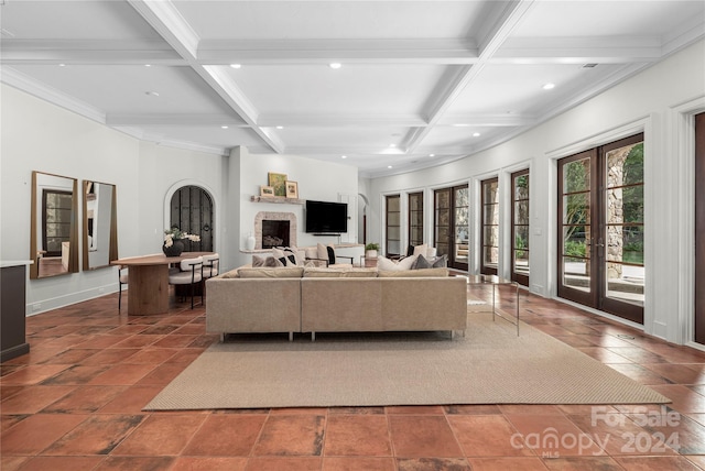 tiled living room featuring french doors, beamed ceiling, and coffered ceiling