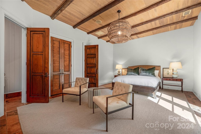 bedroom with lofted ceiling with beams and wooden ceiling