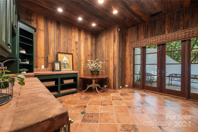 home office with wood walls and wooden ceiling