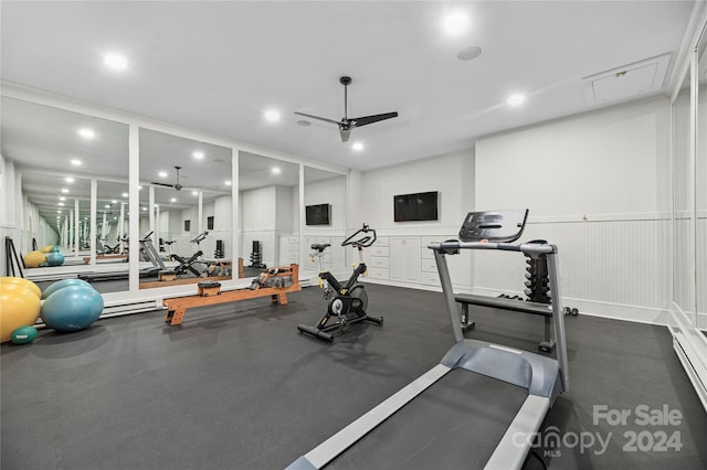 exercise room featuring ceiling fan and a baseboard radiator