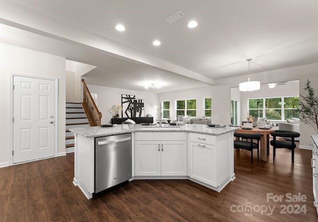 kitchen with open floor plan, stainless steel dishwasher, and dark wood-style flooring