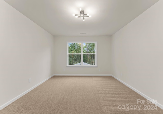 6034 Jepson Ct, Charlotte, NC 28214 - spare room featuring visible vents, carpet, and baseboards