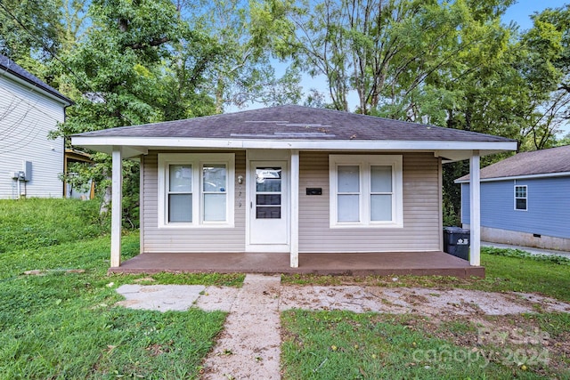 bungalow with a front lawn