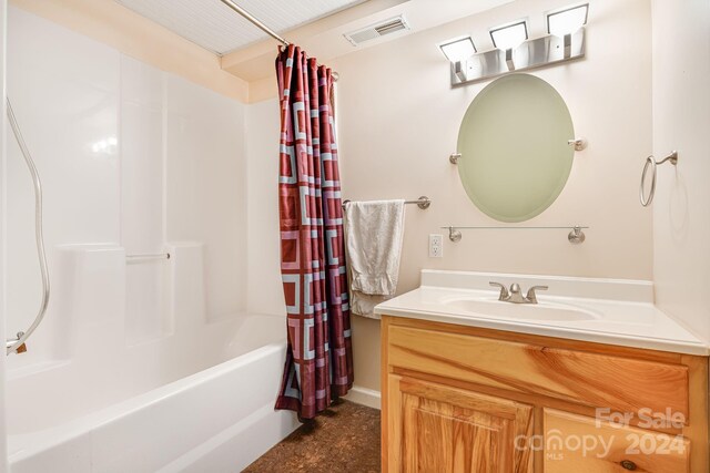 bathroom with vanity and shower / bath combo with shower curtain