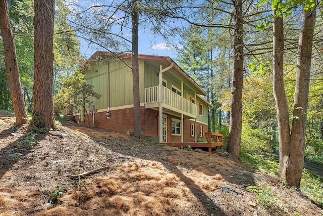 view of home's exterior featuring a wooden deck