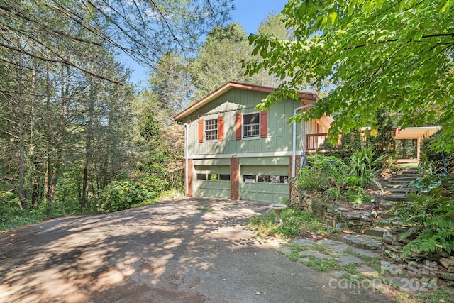 19 Brookcliff Dr, Asheville, NC 28804 - view of side of property featuring driveway and an attached garage