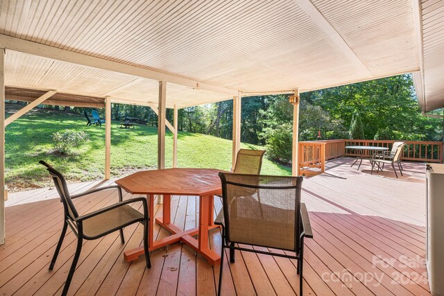 wooden terrace with a yard