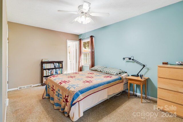 carpeted bedroom with ceiling fan