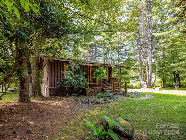 view of yard with a wooden deck