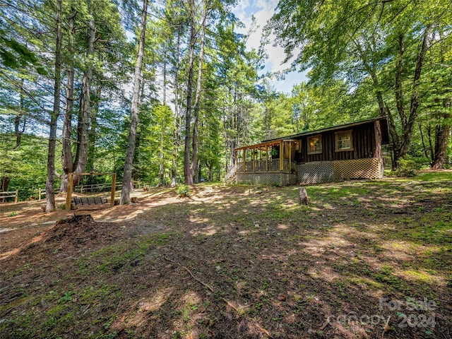 view of yard featuring a wooden deck