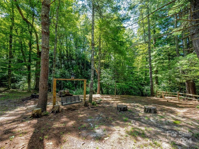 view of yard featuring a view of trees