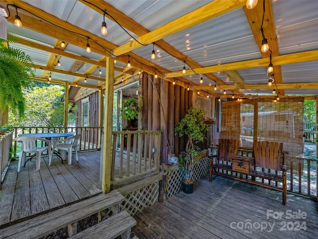 wooden terrace with outdoor dining space