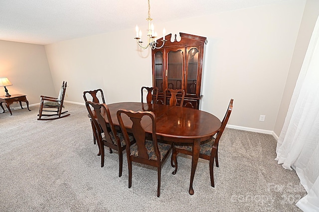 carpeted dining area with baseboards, a textured ceiling, and an inviting chandelier