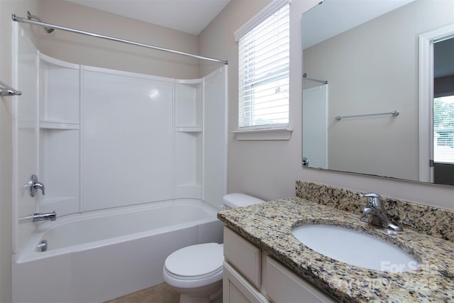 full bathroom featuring vanity, bathing tub / shower combination, and toilet