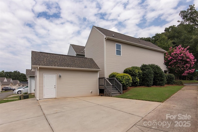 view of property exterior with a yard