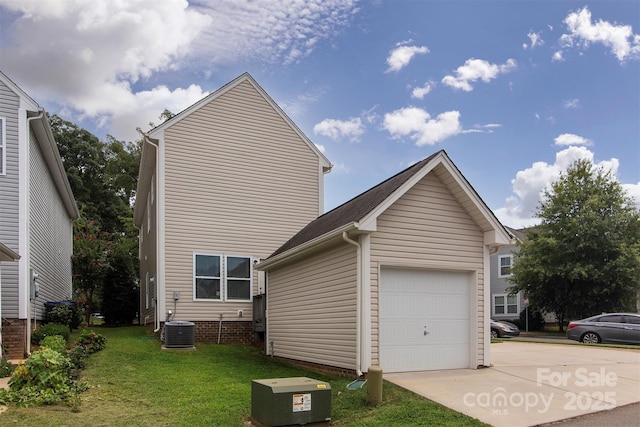 view of property exterior with a garage, an outbuilding, central air condition unit, and a lawn