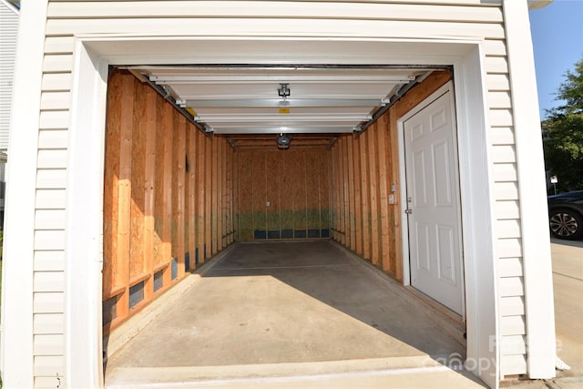 garage featuring wood walls