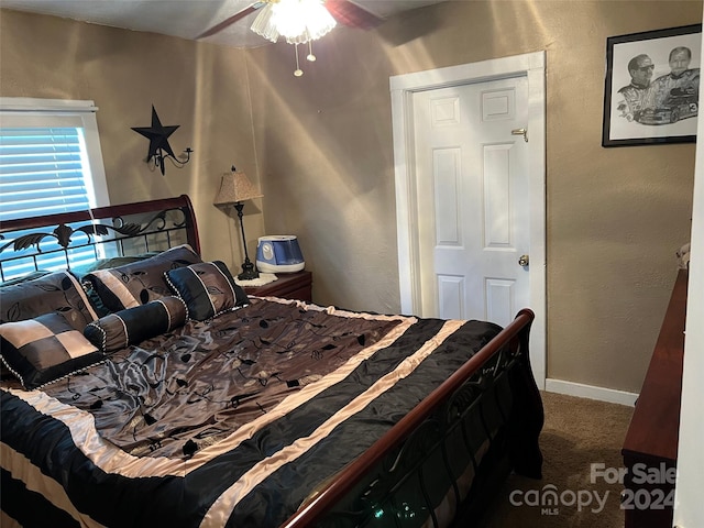 bedroom with carpet floors, ceiling fan, and a closet